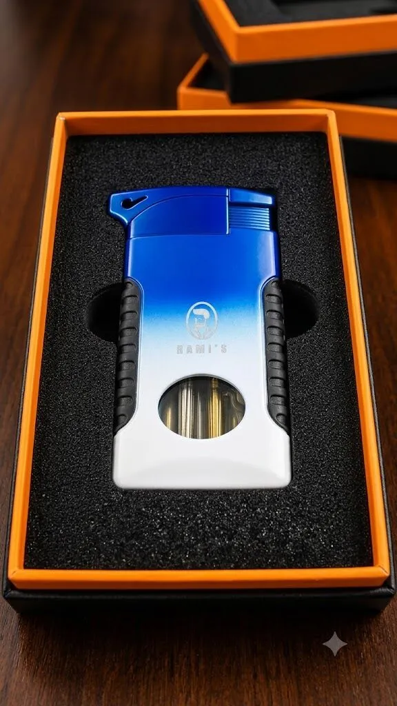 A "Rami's" Pipeliner cigar lighter with a bold blue-to-white gradient finish, presented in a black foam-lined display box with an orange inner border.
