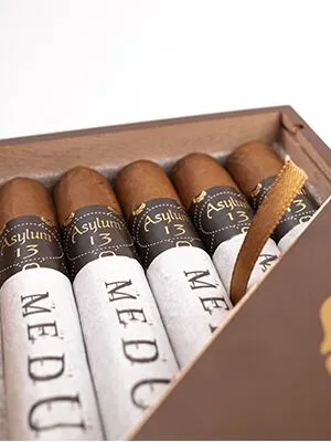 Asylum 13 Medulla Oblongata cigar with a dark, rich wrapper and distinctive band