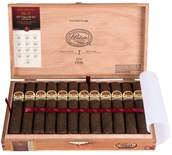 Open box of Padrón 1926 Anniversary Series Maduro cigars with dark, rich wrappers and signature Padrón bands