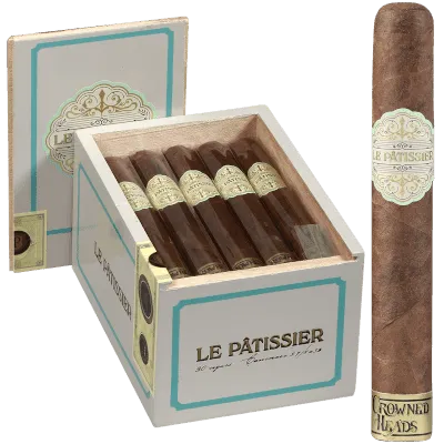 Le Pâtissier cigar standing in front of an open box filled with identical cigars