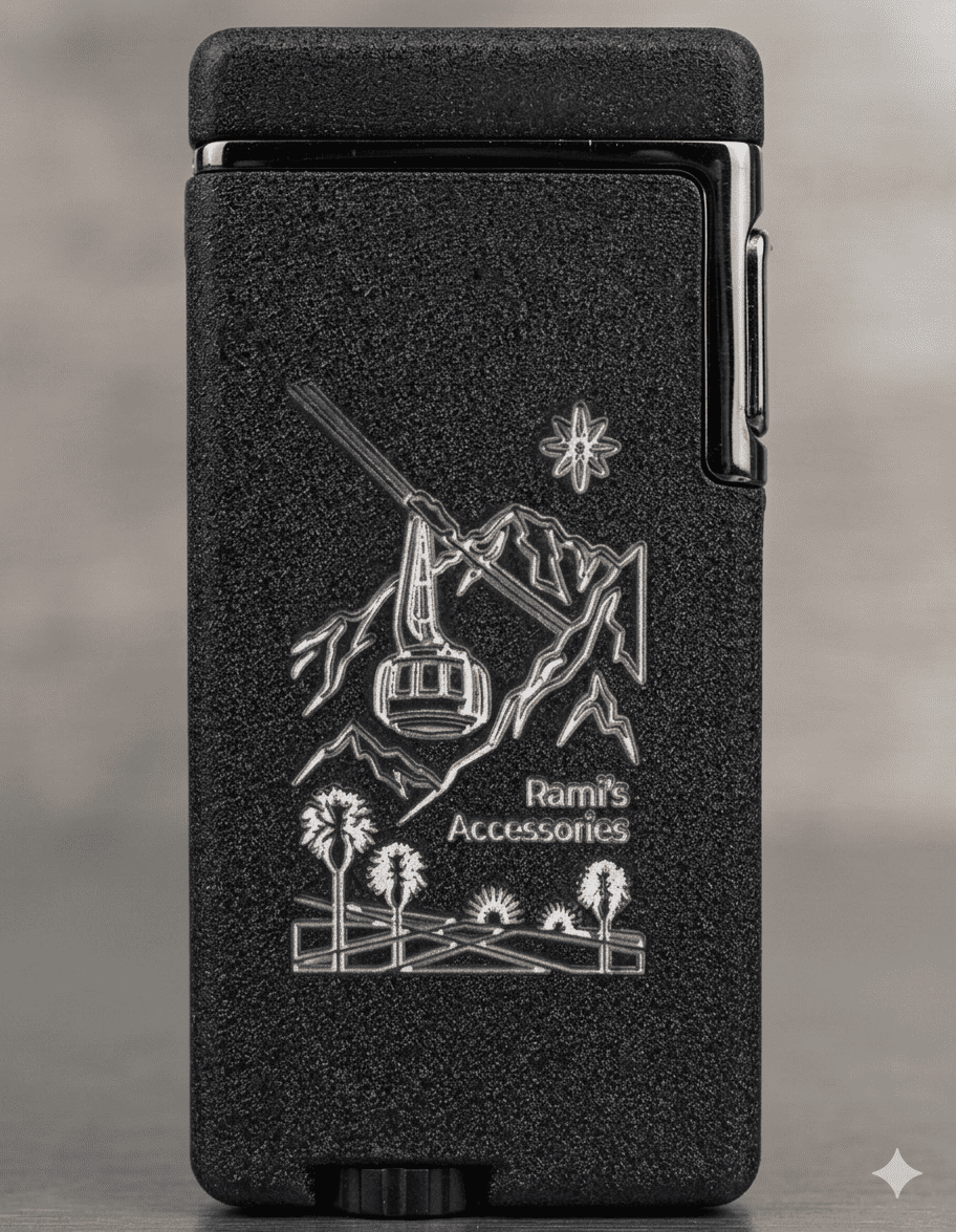 Rami's Tramway Summit Dual Flame Voice-Tap Activated lighter with engraved tramway gondola, mountain peaks, desert palms, and textured black finish.