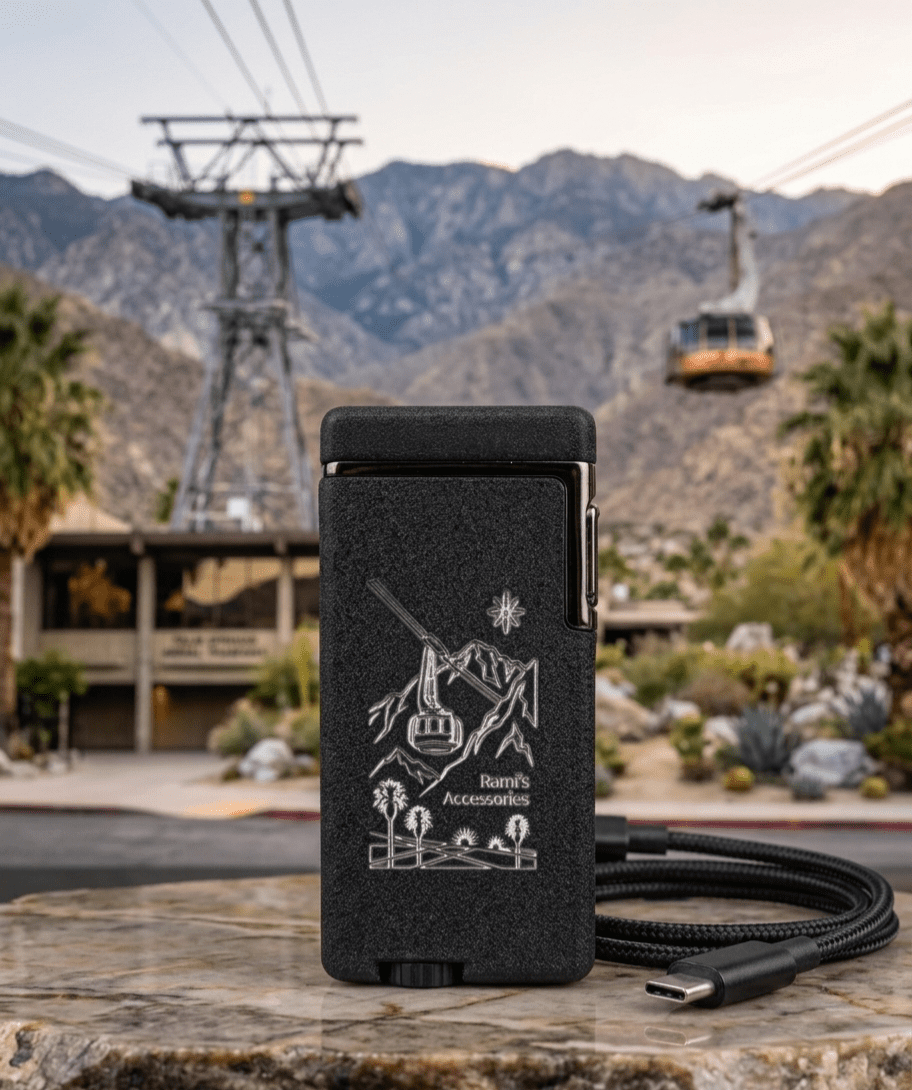 Rami's Tramway Summit rechargeable lighter with custom tramway engraving, Palm Springs mountain backdrop, and USB-C charging cable.