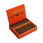 Aging Room Quattro Nicaragua cigar with dark wrapper and gold-accented band resting on wood