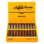 Open box of Aging Room Quattro Sonata Maestro cigars with reddish-brown wrappers and gold-trimmed bands
