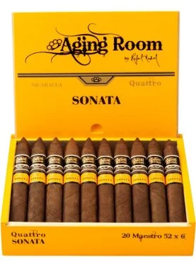 Open box of Aging Room Quattro Sonata Maestro cigars with reddish-brown wrappers and gold-trimmed bands