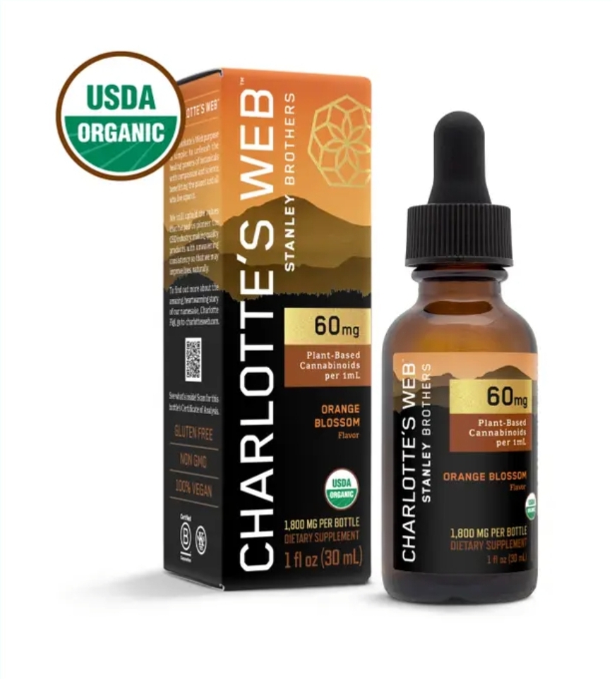 Charlotte’s Web 60MG CBD Oil bottle standing upright, showcasing label and amber glass design.