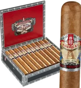 Single Alec Bradley American Classic cigar with smooth brown wrapper, placed in front of an open box filled with cigars.