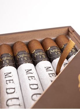 Asylum 13 Medulla Oblongata cigar with a dark, rich wrapper and distinctive band