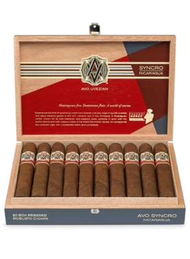 Open box of AVO Synchro Nicaragua cigars displaying rich brown wrappers and vibrant cigar bands.