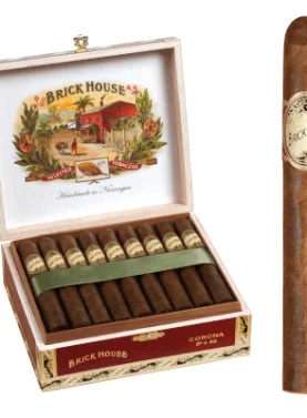 Brick House Classic cigar with natural sun-grown wrapper resting on a rustic wood background