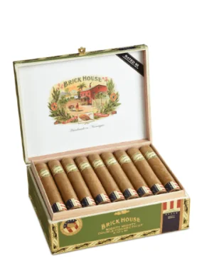 Brick House Double Connecticut cigar with a smooth, light-brown Connecticut Shade wrapper resting on a dark wood surface