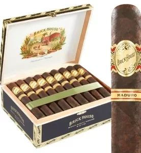 Brick House Maduro cigar with a dark, oily wrapper resting on a wooden surface