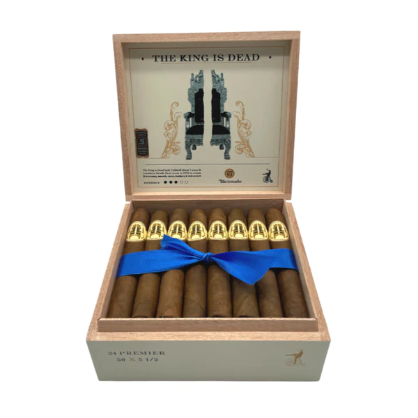 Open box of The King is Dead cigars featuring rustic, dark brown wrappers and bold, modern Caldwell branding.