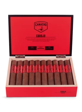 Open box of Camacho Corojo cigars featuring bold red bands and rich brown wrappers