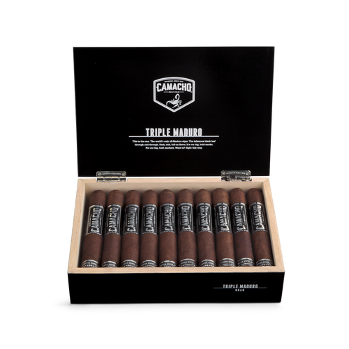 Open box of Camacho Triple Maduro cigars with dark wrappers and bold black-and-silver bands