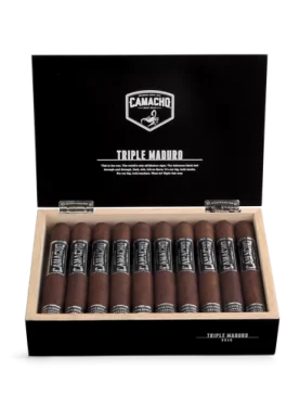 Open box of Camacho Triple Maduro cigars with dark wrappers and bold black-and-silver bands