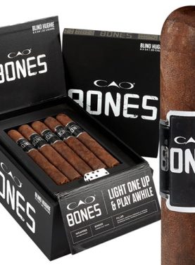 Open box of CAO Bones cigars featuring dark Ecuadorian Sumatra wrappers and poker-inspired branding
