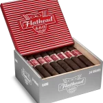 Open box of CAO Flathead cigars with dark, box-pressed wrappers and retro automotive-themed packaging.