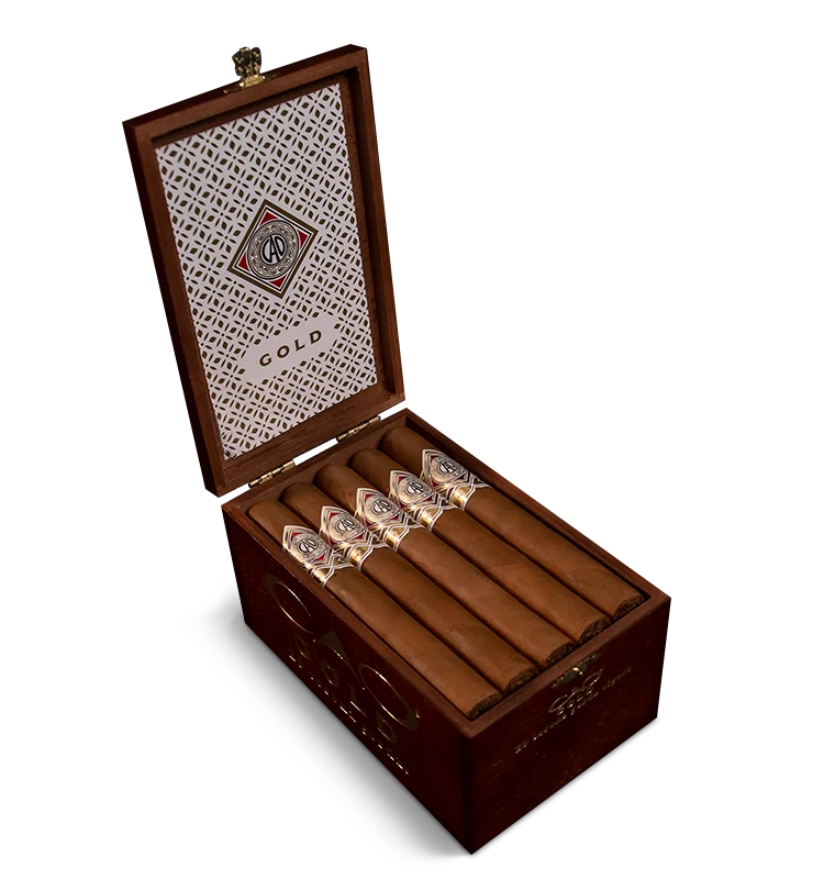 Open box of CAO Gold cigars with light Ecuadorian Connecticut wrappers and elegant presentation.