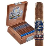 Single Don Pepin Garcia Original cigar with open box in the background