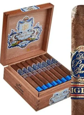 Single Don Pepin Garcia Original cigar with open box in the background