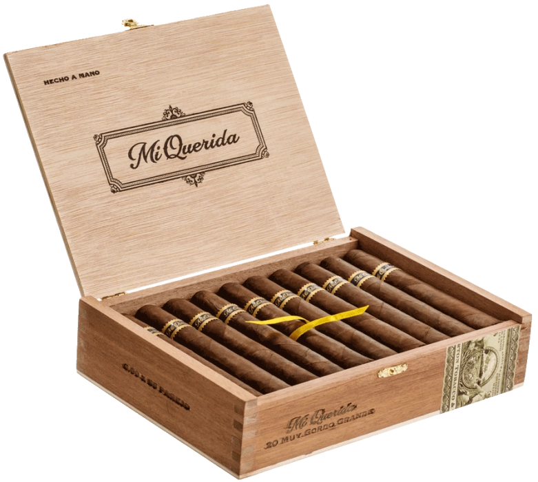 Open box of Mi Querida cigars with dark, earthy wrappers and bold banding