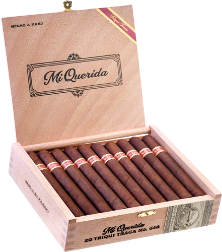 Open box of Mi Querida Triqui Traca cigars with dark, rustic wrappers and elegant banding
