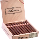 Open box of Mi Querida Triqui Traca cigars with dark, rustic wrappers and elegant banding