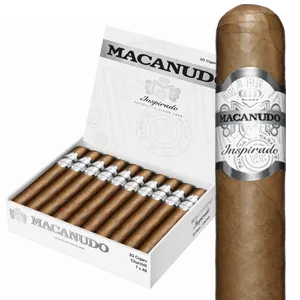 Open box of Macanudo Inspirado White cigars with light Ecuadorian Connecticut wrappers and elegant silver-accented bands.