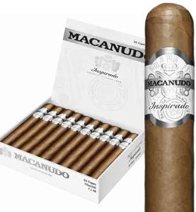Open box of Macanudo Inspirado White cigars with light Ecuadorian Connecticut wrappers and elegant silver-accented bands.