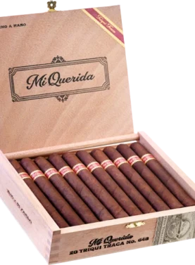 Open box of Mi Querida Triqui Traca cigars with dark, rustic wrappers and elegant banding