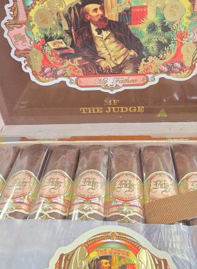 : Open box of My Father The Judge cigars neatly arranged