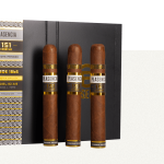 Four Plasencia Cosecha 151 cigars resting on a box of the same, showcasing their rich, dark wrappers and premium craftsmanship