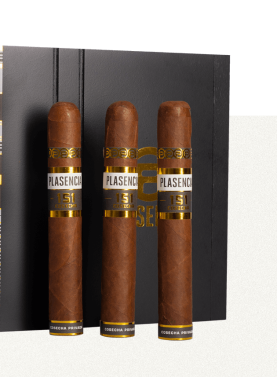 Four Plasencia Cosecha 151 cigars resting on a box of the same, showcasing their rich, dark wrappers and premium craftsmanship