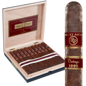 Open box of Rocky Patel 1990 Broadleaf cigars, featuring the dark, rich broadleaf wrappers and neat arrangement inside