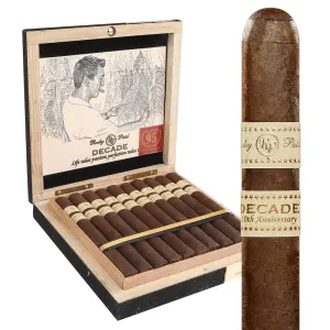Open box of Rocky Patel Decade cigars, displaying dark Sumatra wrappers and elegant gold-and-black bands.
