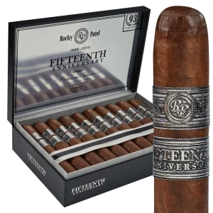 Open box of Rocky Patel Fifteenth Anniversary cigars with dark, box-pressed wrappers and silver-accented bands.