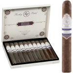 Open box of Rocky Patel Special Edition cigars, showcasing dark, oily Habano wrappers and elegant banding.