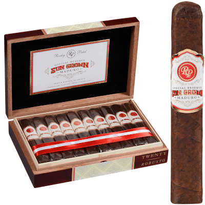 Open box of Rocky Patel Sungrown Maduro cigars showing dark, oily wrappers neatly arranged