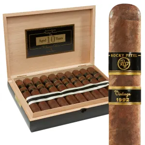 Open box of Rocky Patel Vintage 1992 cigars, showcasing their rich, aged Ecuadorian Sumatra wrappers and neat arrangement.