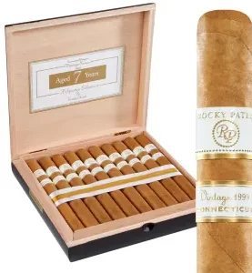 Open box of Rocky Patel Vintage 1999 cigars, neatly arranged with their smooth Connecticut Shade wrappers.