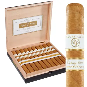 Open box of Rocky Patel Vintage 1999 cigars, neatly arranged with their smooth Connecticut Shade wrappers.