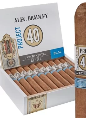 Single The Project 40 cigar with medium brown wrapper, positioned in front of an open box displaying multiple cigars.