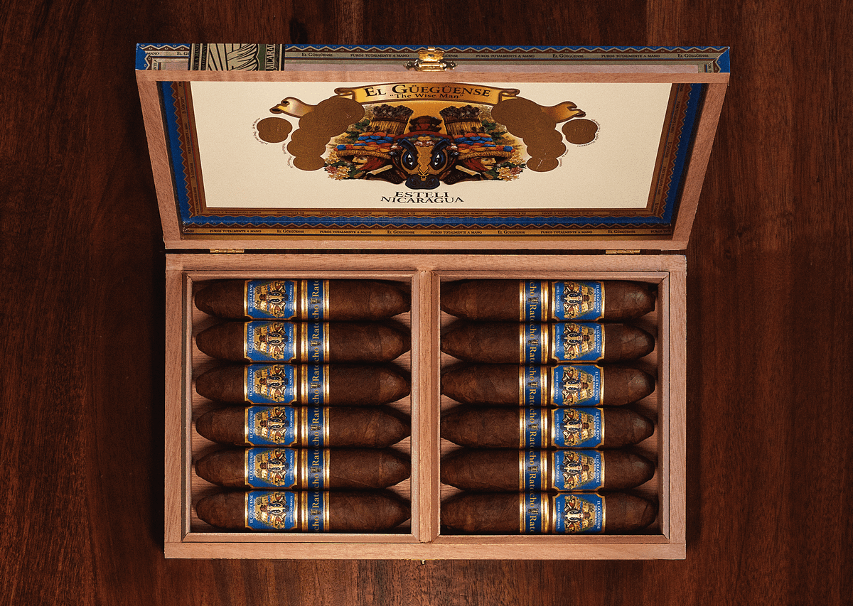 Open box of The Wise Man Corojo cigars, featuring smooth, reddish-brown wrappers neatly arranged in a premium wooden box.