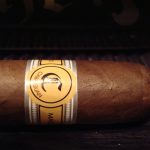 Single Cabaiguan cigar with smooth, light brown Ecuadorian Connecticut wrapper and elegant band.