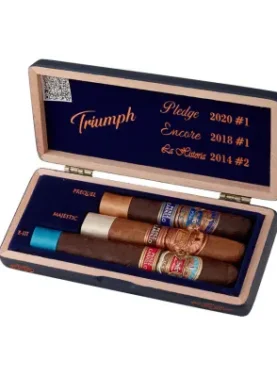E.P. Carrillo Trilogy Triumph Sampler featuring three premium cigars from La Historia, E.P. Carrillo Core, and Pledge blends, each with distinct wrappers and bands, showcasing the variety and craftsmanship of E.P. Carrillo cigars