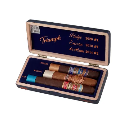 E.P. Carrillo Trilogy Triumph Sampler featuring three premium cigars from La Historia, E.P. Carrillo Core, and Pledge blends, each with distinct wrappers and bands, showcasing the variety and craftsmanship of E.P. Carrillo cigars