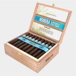 Open box of Herrera Estelí Brazilian Maduro cigars showcasing dark, rich wrappers.