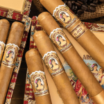 Box of La Aroma de Cuba Connecticut cigars featuring light Ecuadorian Connecticut wrappers and decorative bands.