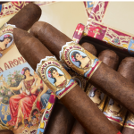 Box of La Aroma de Cuba Original cigars arranged neatly with vintage-style bands and rich brown wrappers.